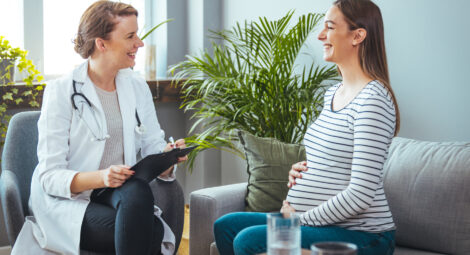 Pregnant woman talking to provider