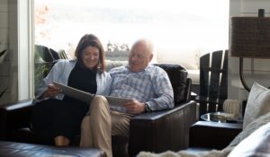 Two people on a coach reading