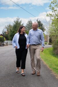 Two people walking outside.