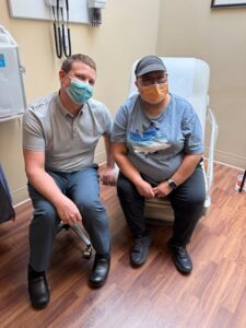 woman sitting next to her doctor