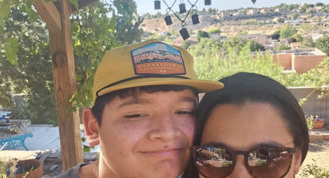 Eighteen year old boy pictured with his mother.