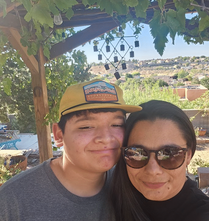Eighteen year old boy pictured with his mother.