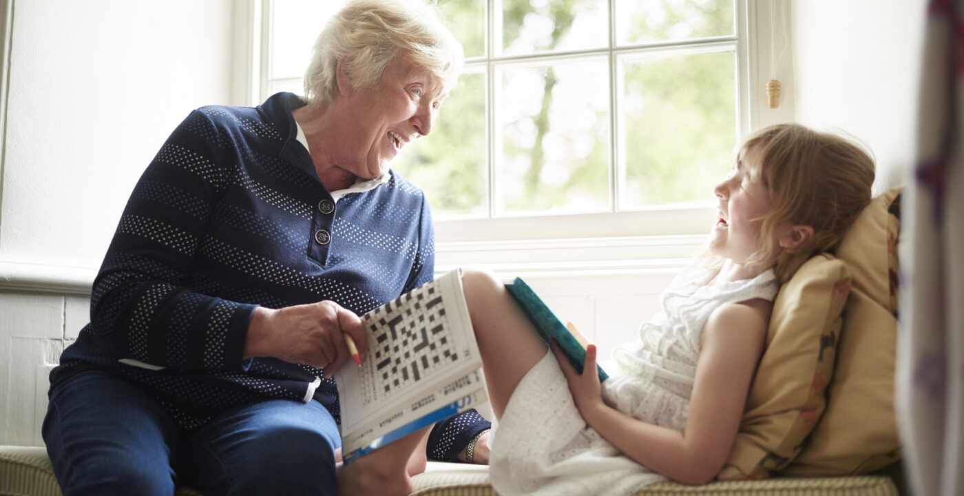 Grandmother laughing with her granddaughter