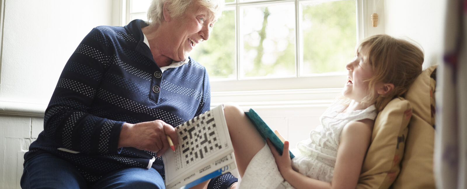 Grandmother laughing with her granddaughter