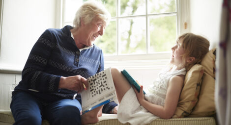 Grandmother laughing with her granddaughter