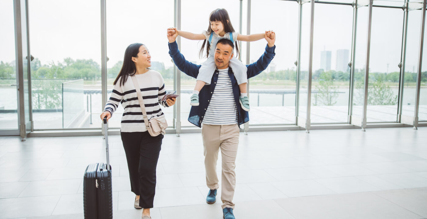 A mother, father and child at the airport