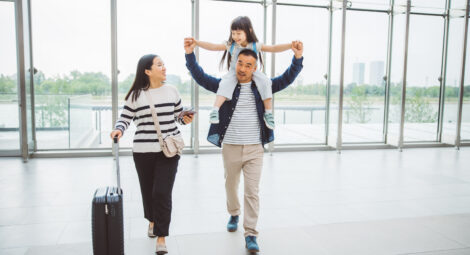 A mother, father and child at the airport