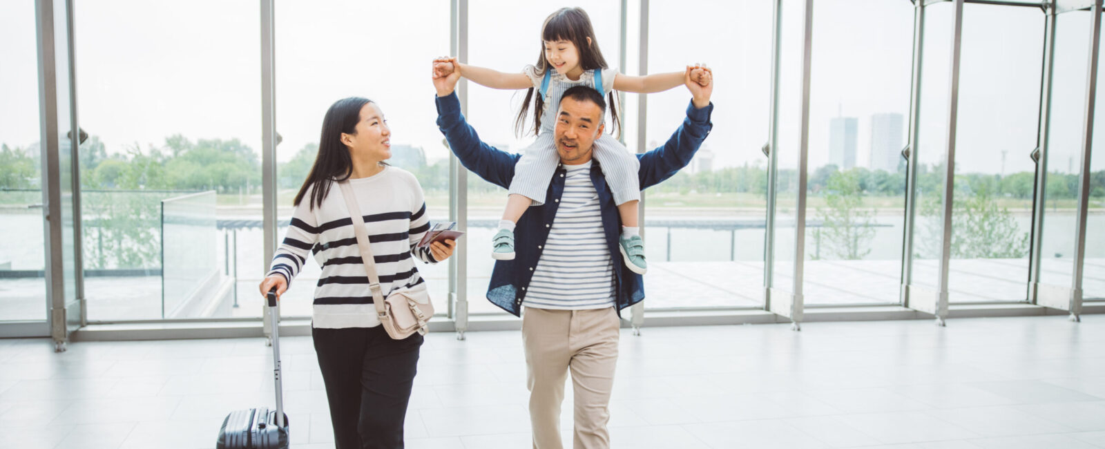 A mother, father and child at the airport
