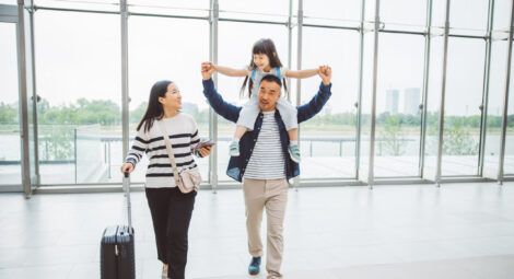 A mother, father and child at the airport