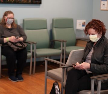 Masked patients in waiting room