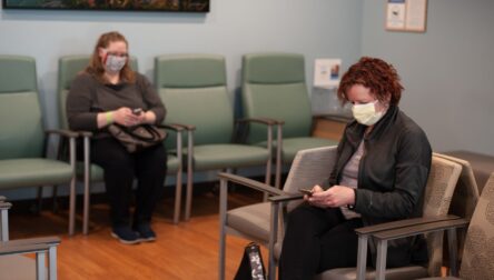 Masked patients in waiting room