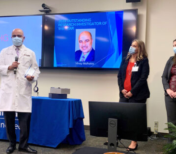 Dr. Malhotra accepts award