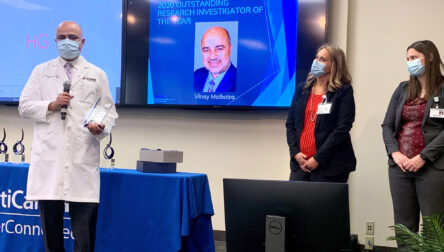 Dr. Malhotra accepts award