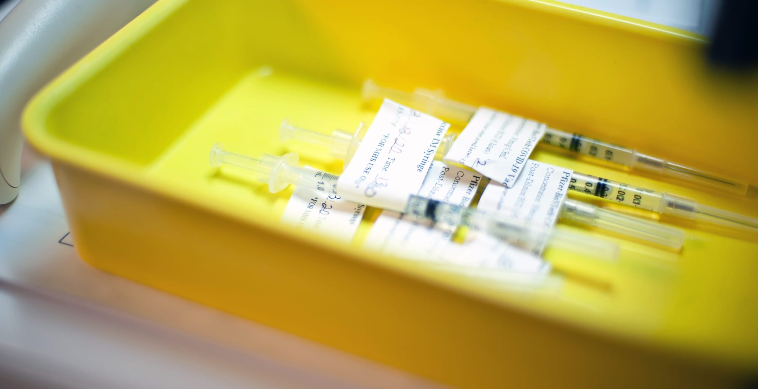 Vaccines in a yellow tub