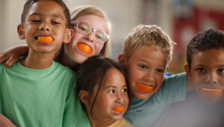 Group of kids with oranges