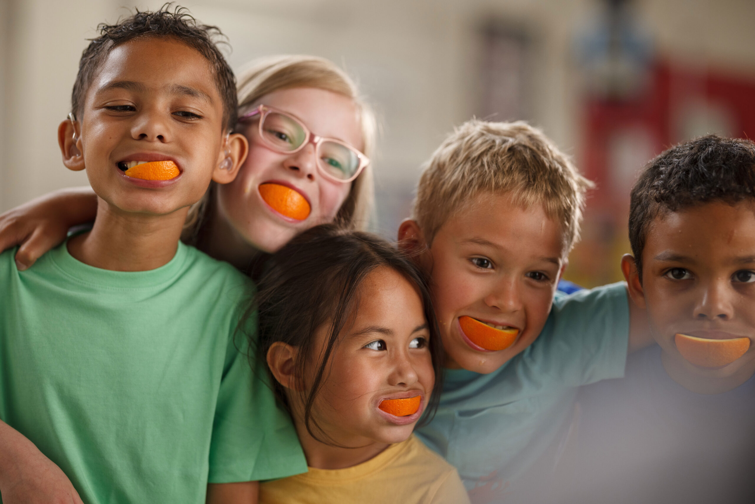 Group of kids with oranges