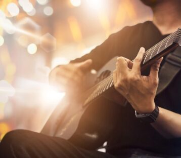 Guy playing a guitar