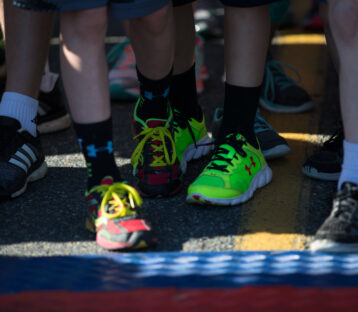 Participants at the starting line in sneakers