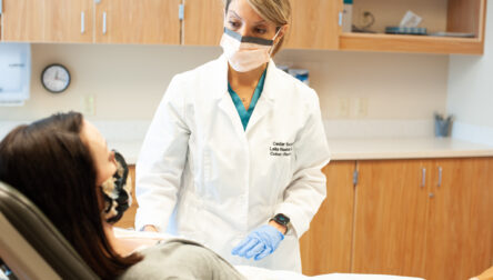 Laila Rashidi, MD, FACS, FACRS, with patient