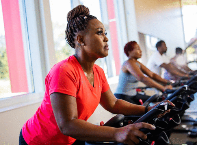 Woman on exercise bike.