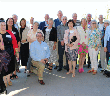 Capital Foundation Board of Directors poses for a photo on an outdoor patio
