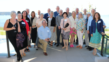 Capital Foundation Board of Directors poses for a photo on an outdoor patio