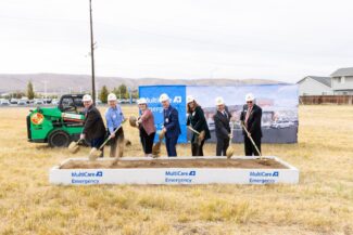 MultiCare team lines up with shovels to officially break ground on construction.