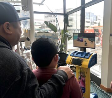 Young patient plays Pokemon on Starlight gaming console at Mary Bridge Children's