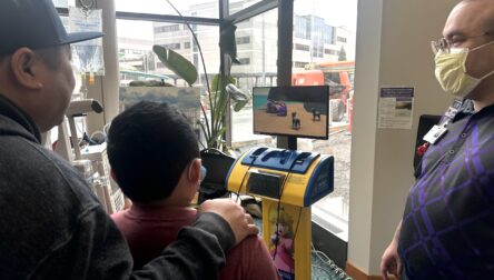 Young patient plays Pokemon on Starlight gaming console at Mary Bridge Children's