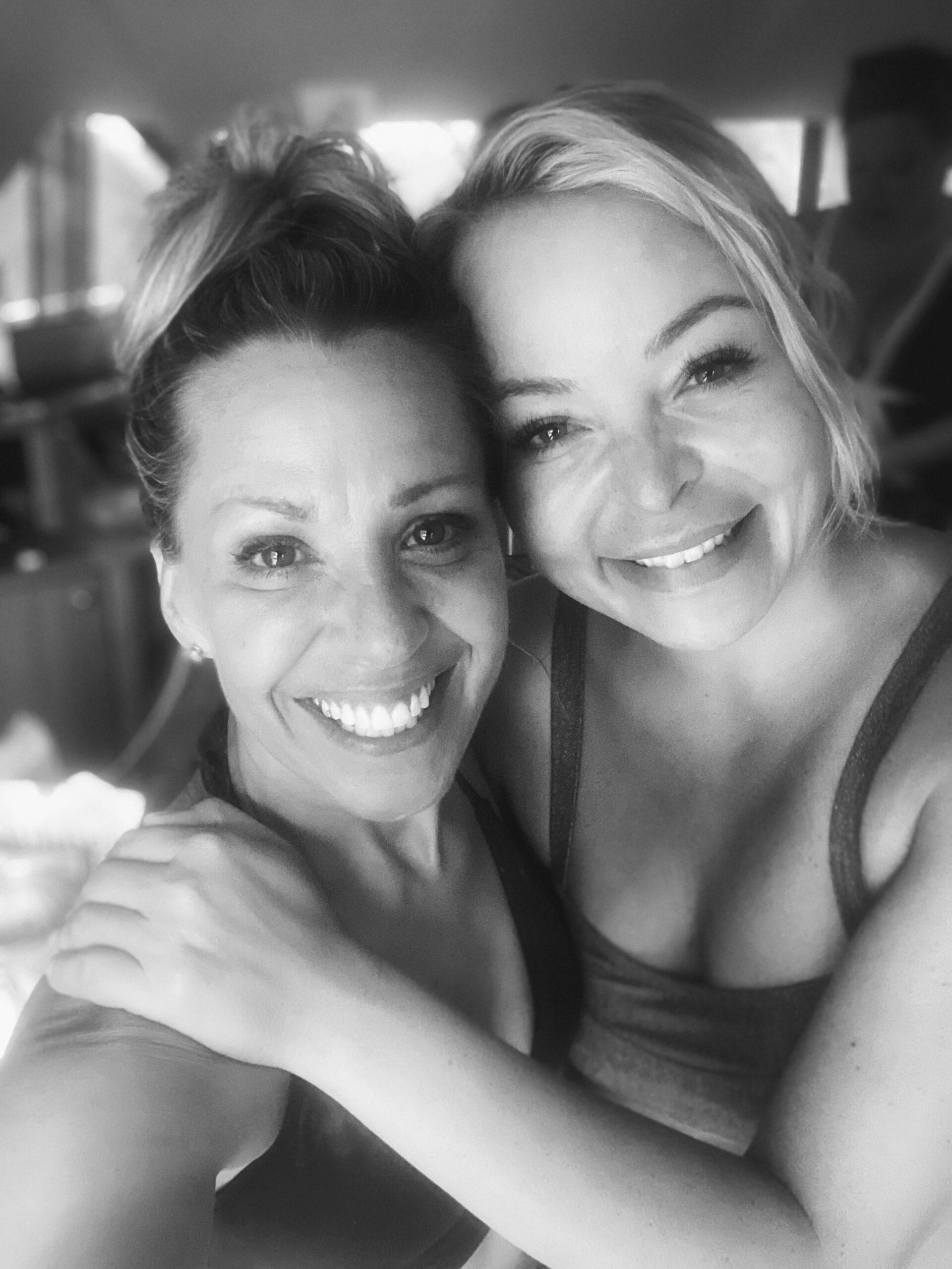 Two smiling women.