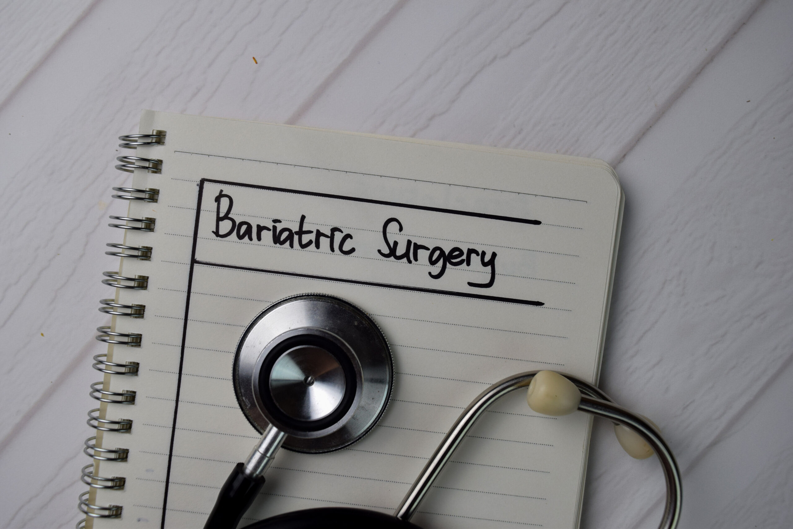 Stethoscope on top of notebook that says bariatric surgery