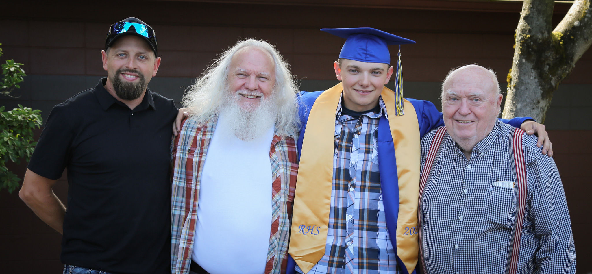 Four generations of men at high school graduation