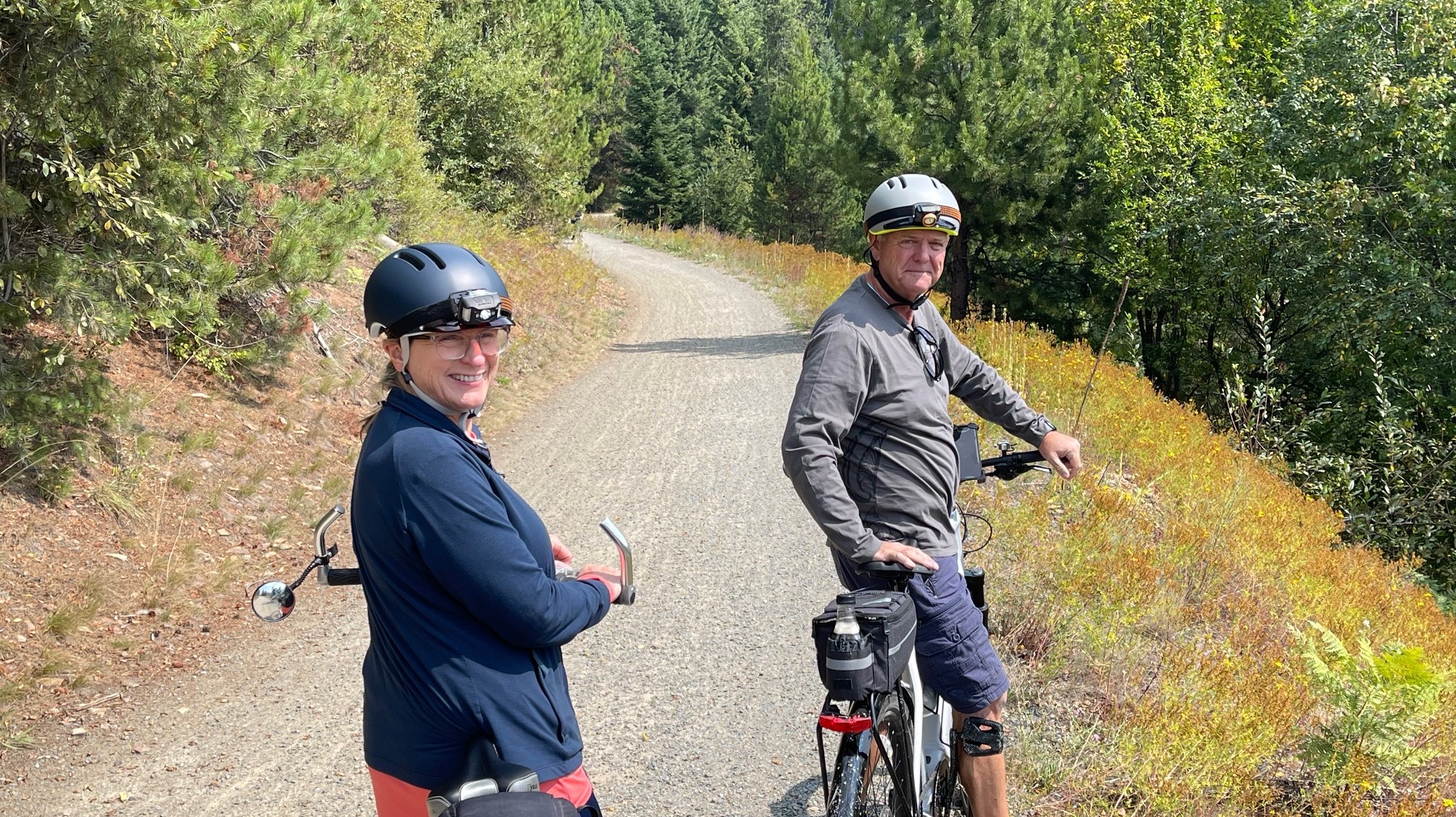 Man and woman on bike trail