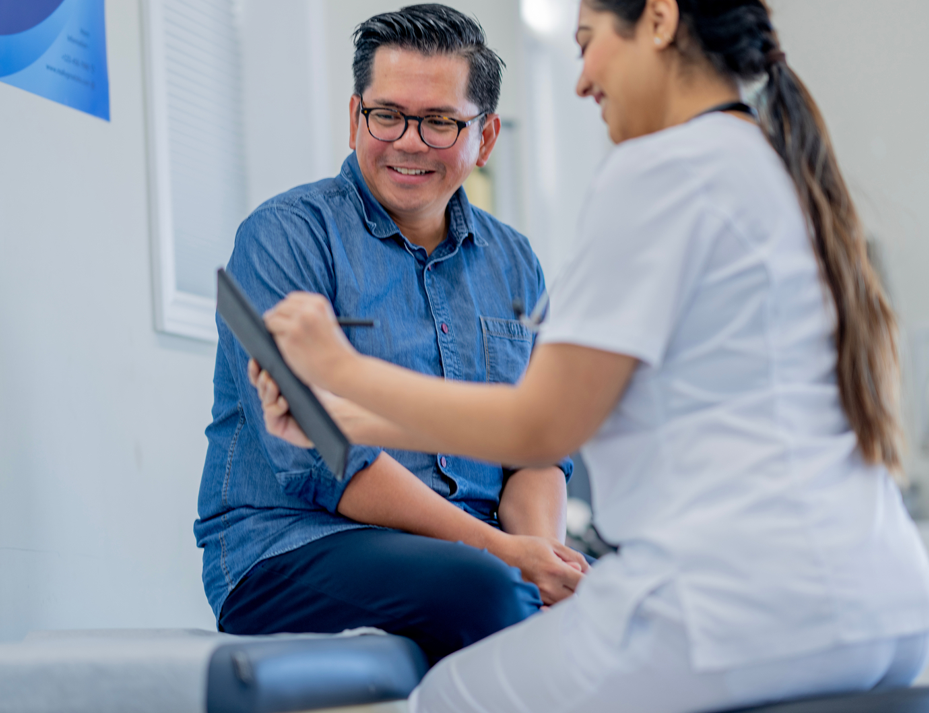 Male patient and female doctor review test results