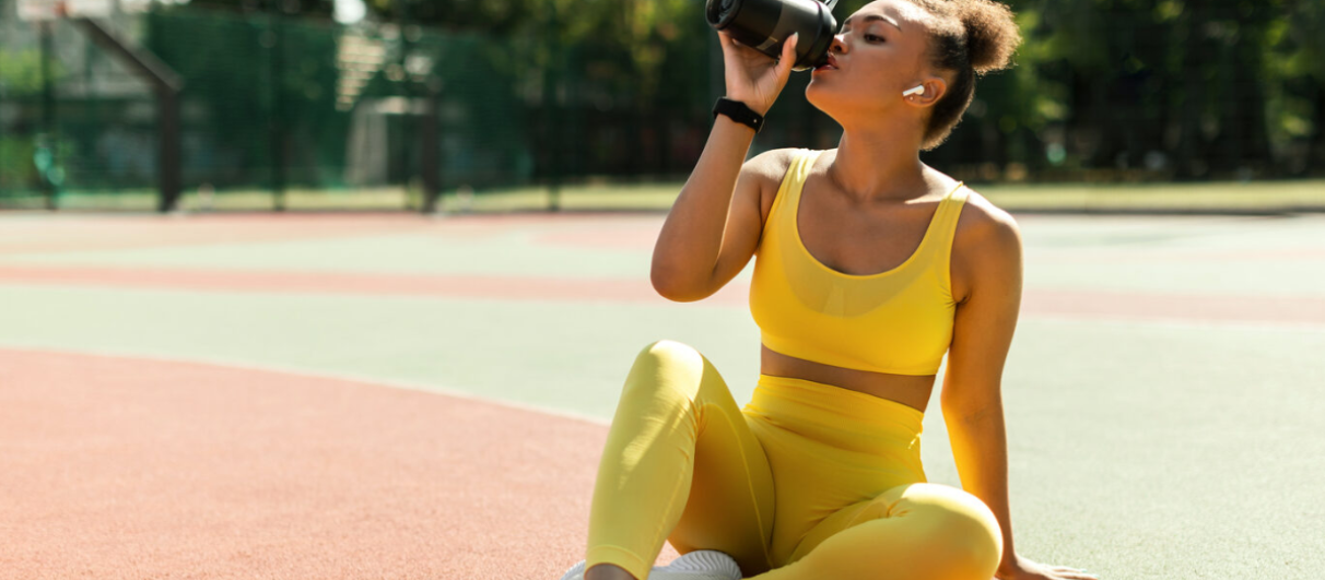 woman-drinking-water-on-track