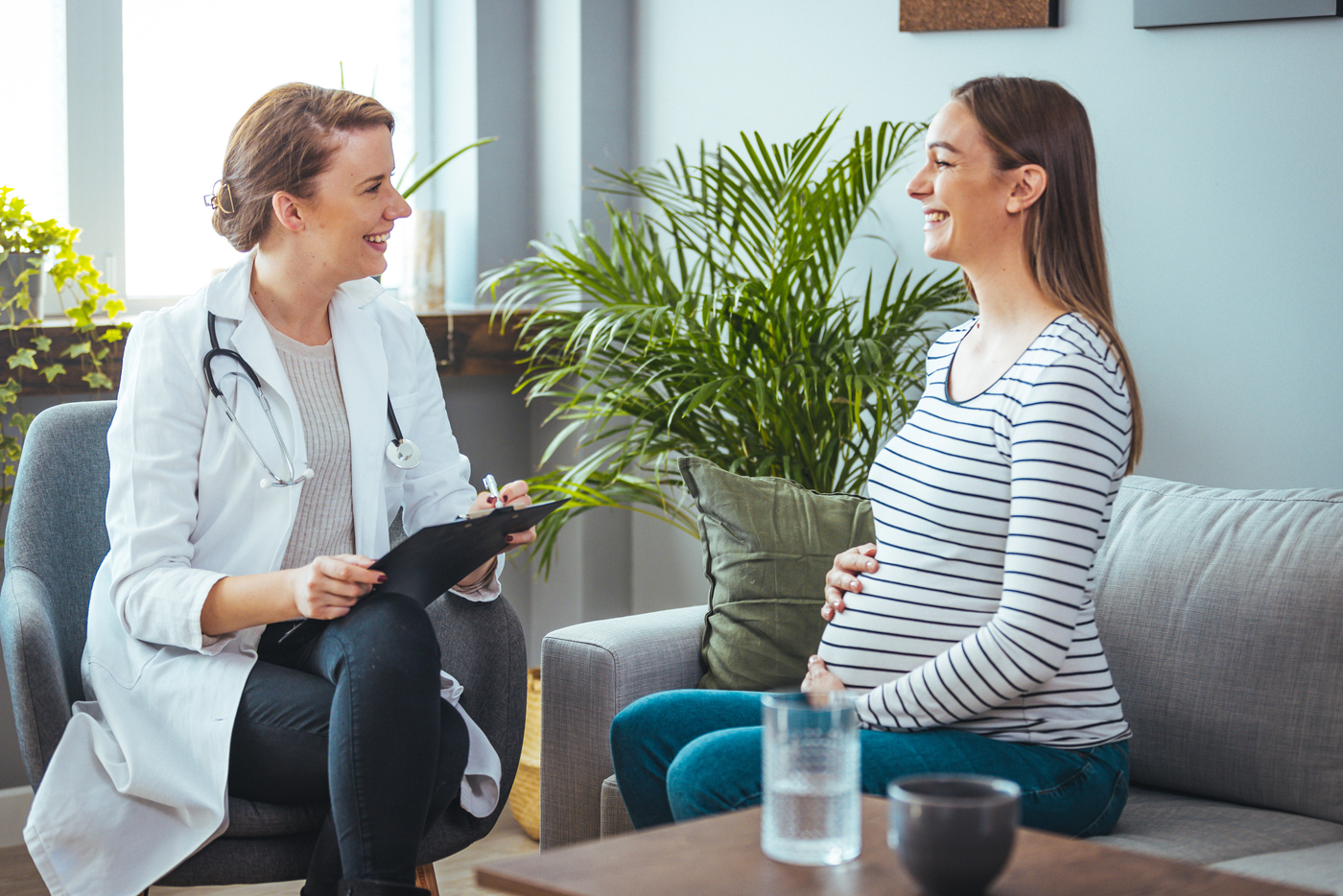 Pregnant woman talking to provider
