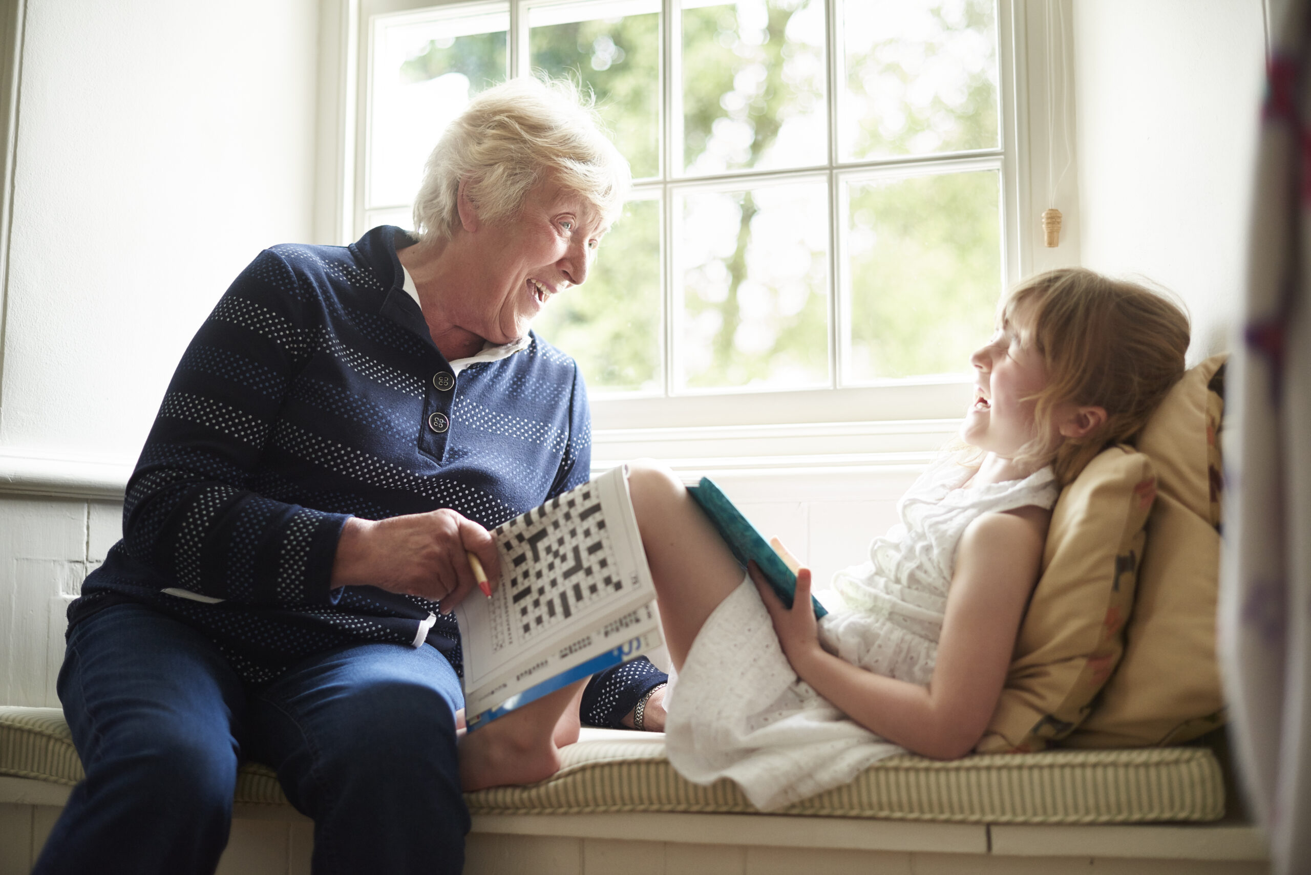 Grandmother laughing with her granddaughter